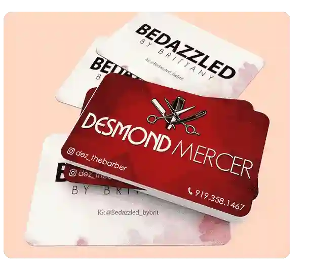 stack of barbershop and bedazzled business cards